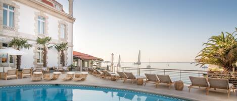 Outdoor pool, pool umbrellas, pool loungers