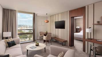 Junior Suite, 1 King Bed, Balcony | Living room | 32-inch LCD TV with satellite channels, TV