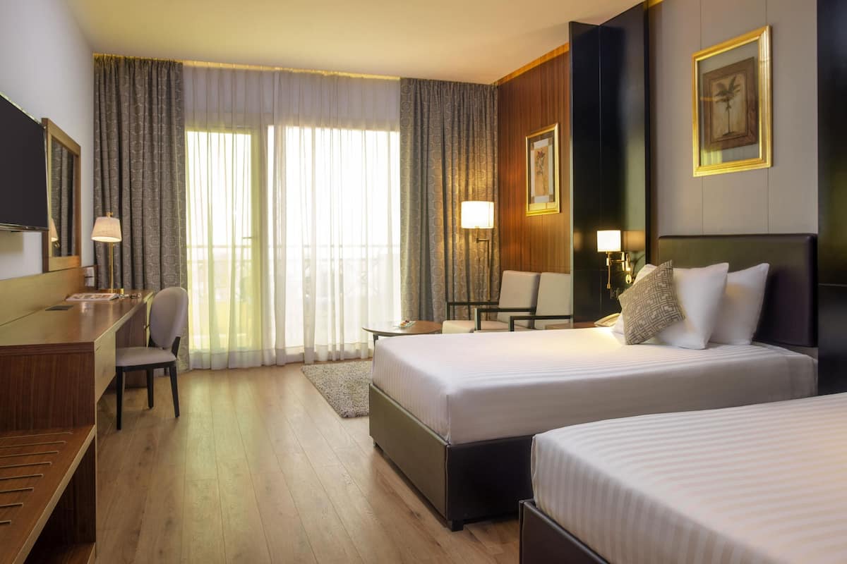 Premium bedding, memory-foam beds, minibar, in-room safe