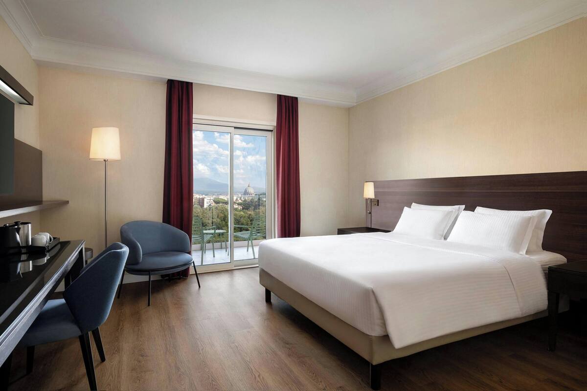 Room, 1 King Bed (View) | Premium bedding, in-room safe, desk, blackout drapes