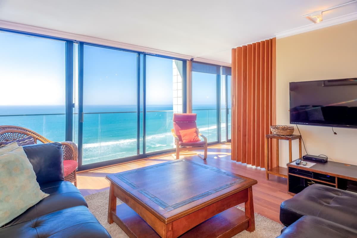 2-Bedroom Condominium - 905 | Living area | 32-inch flat-screen TV with cable channels, TV, DVD player