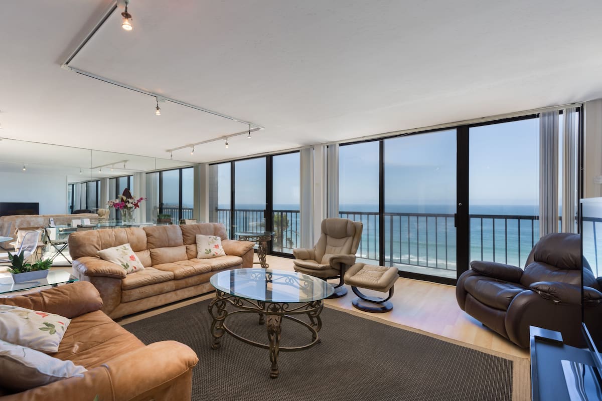 3-Bedroom Condominium - 501 | Living area | 32-inch flat-screen TV with cable channels, TV, DVD player