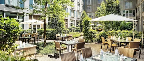 Dinner served, German cuisine, garden views
