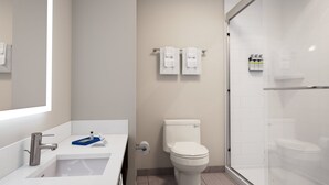 A modern bathroom with a white sink, toilet, and shower. - Holiday Inn Express And Suites Seattle Downtown - Lake Union by IHG (Seattle)