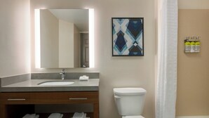 A bathroom with a sink, mirror, toilet, and towels. - Holiday Inn Express And Suites Seattle Downtown - Lake Union by IHG (Seattle)