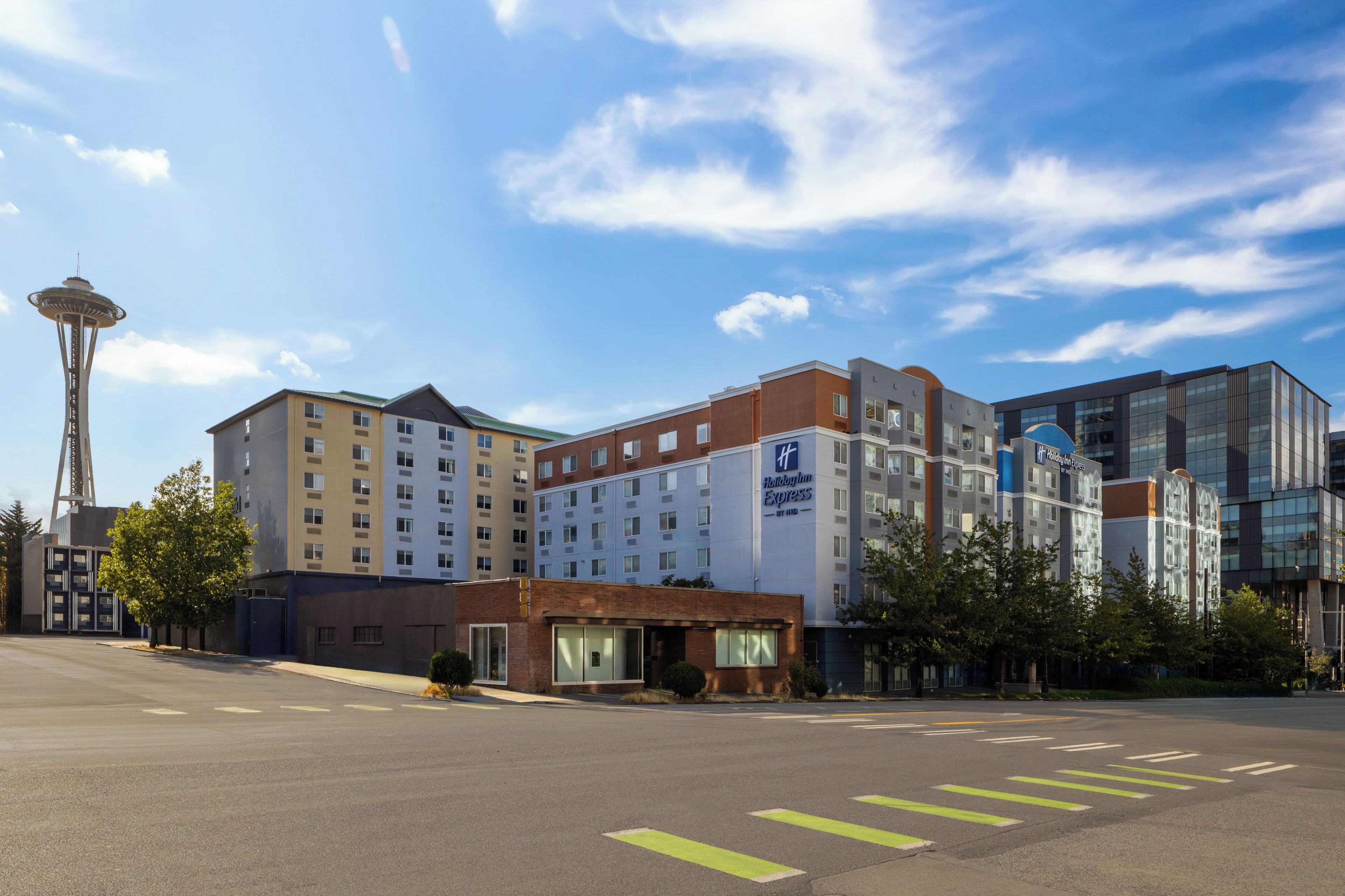A Holiday Inn Express hotel with a modern design, located near the Space Needle.