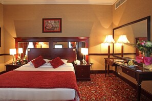 Suite | Down comforters, minibar, in-room safe, individually decorated