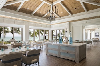 A spacious lobby with a grand chandelier, elegant seating, and a reflective floor. at The Ritz-Carlton, Sarasota