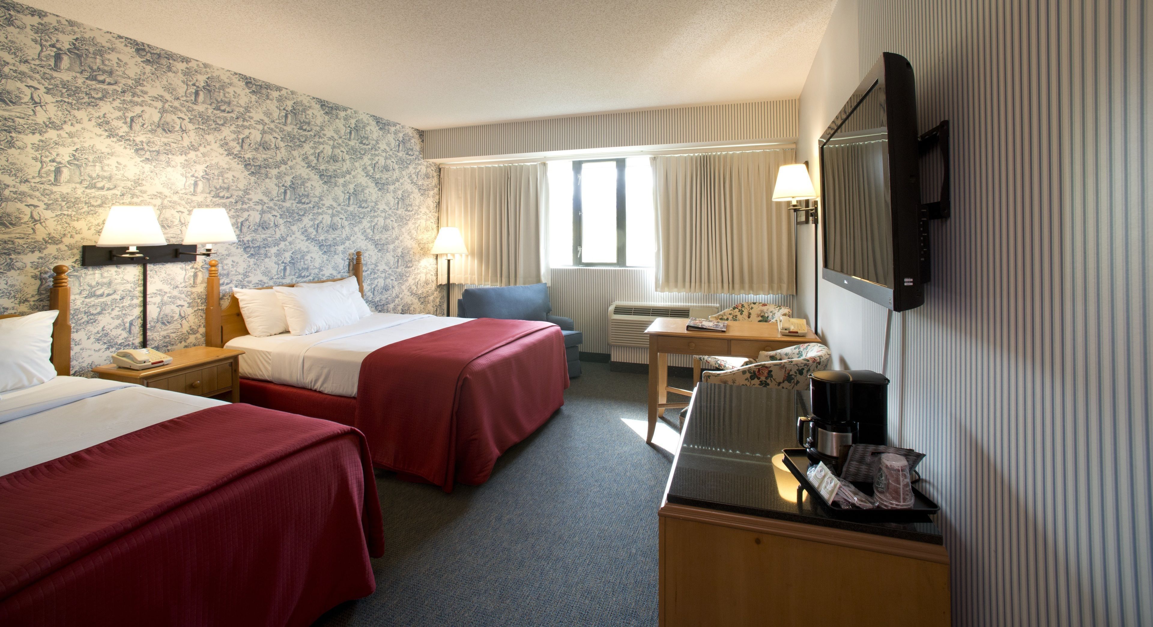 Premium bedding, desk, laptop workspace, blackout curtains