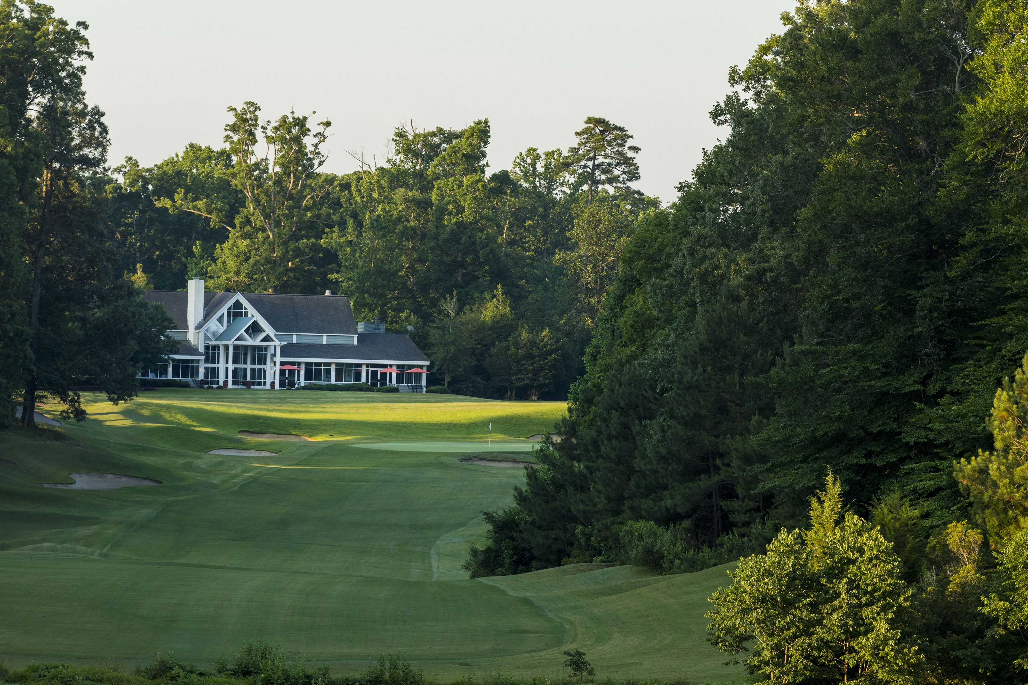 A golf course with a clubhouse.