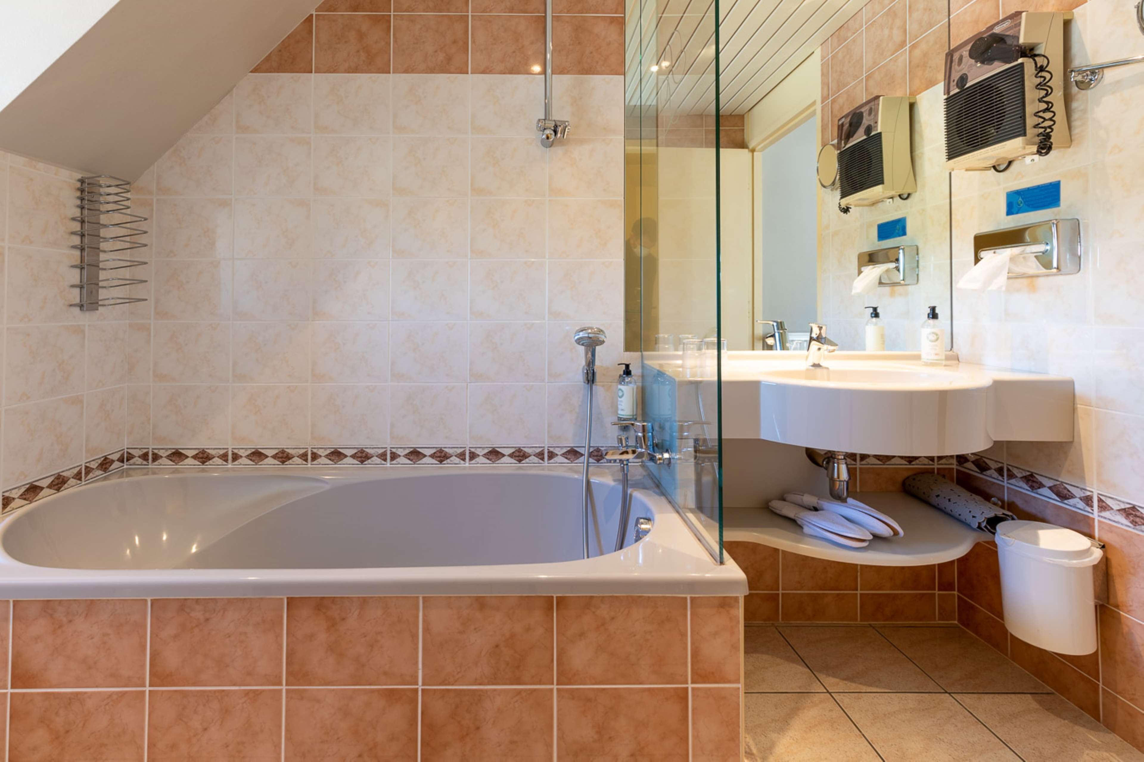 junior suite, 1 queen bed, non smoking (living room;with sofabed) | bathroom | eco-friendly toiletries, hair dryer, bathrobes, slippers