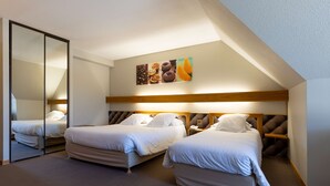 A hotel room with two beds, a large mirror, a headboard with storage, and a wall-mounted artwork. - Best Western Le Relais de Laguiole Hotel & Spa (Laguiole)