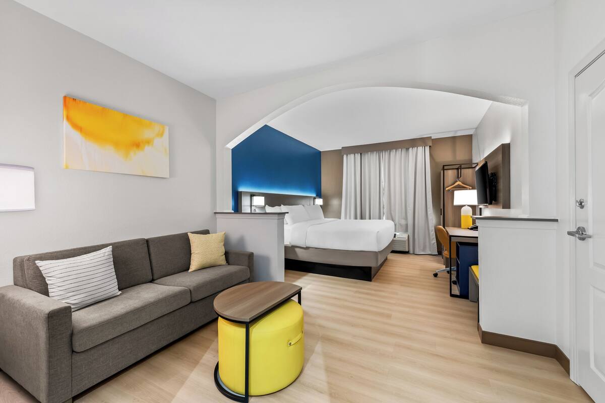 Suite, 1 King Bed, Non Smoking | 1 bedroom, desk, laptop workspace, iron/ironing board