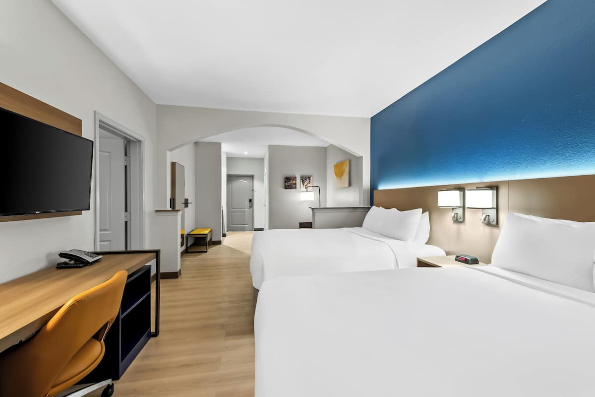 Suite, Non Smoking | 1 bedroom, desk, laptop workspace, iron/ironing board
