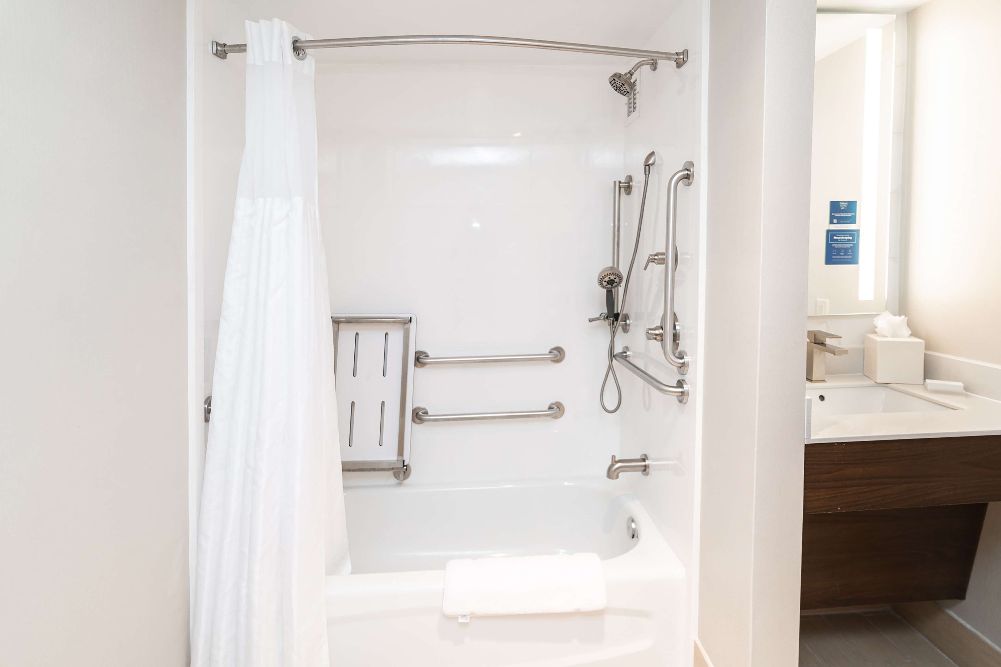 designer toiletries, hair dryer, towels