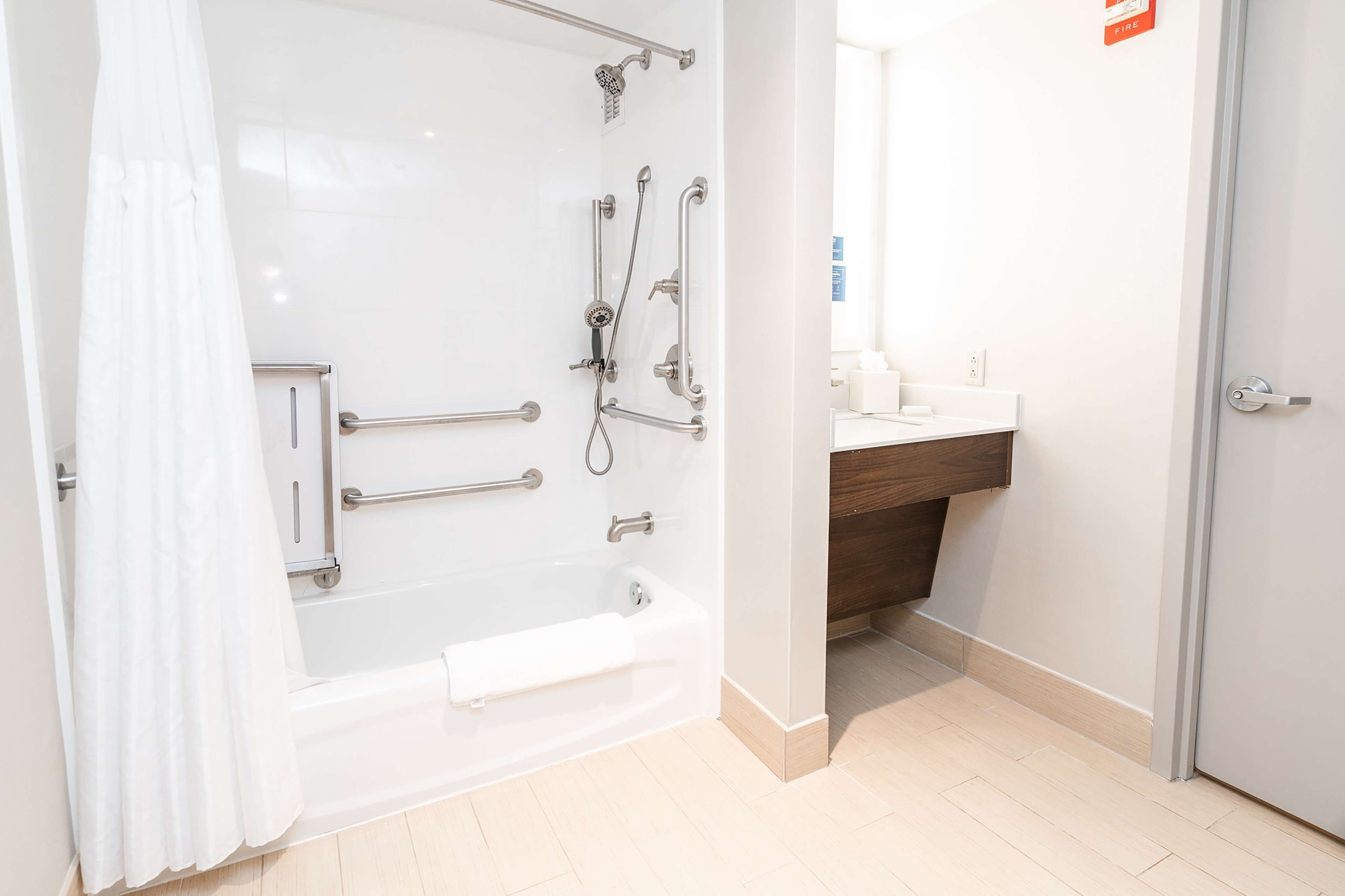 designer toiletries, hair dryer, towels