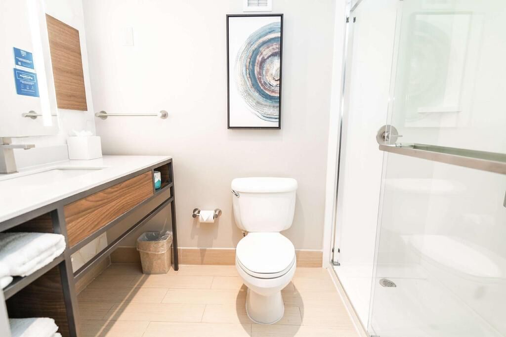 Designer toiletries, hair dryer, towels