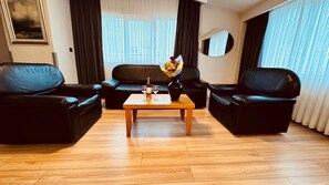 Classic Studio Suite | Living area | 26-cm LCD TV with cable channels, TV