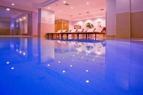 Indoor pool, open 10:00 AM to 9:00 PM, pool loungers, lifeguards on site