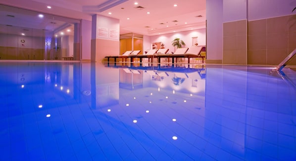 Indoor pool, open 10:00 AM to 9:00 PM, pool loungers, lifeguards on site