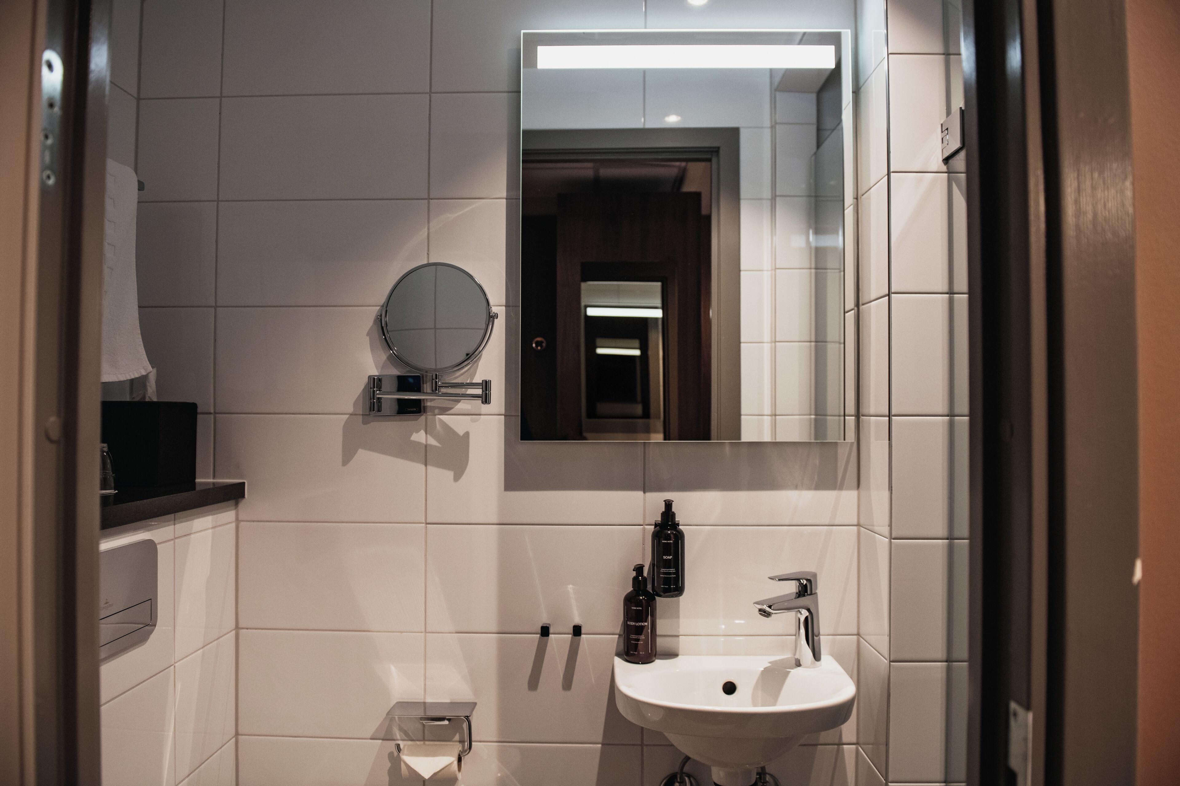 compact single | bathroom | shower, hair dryer, towels