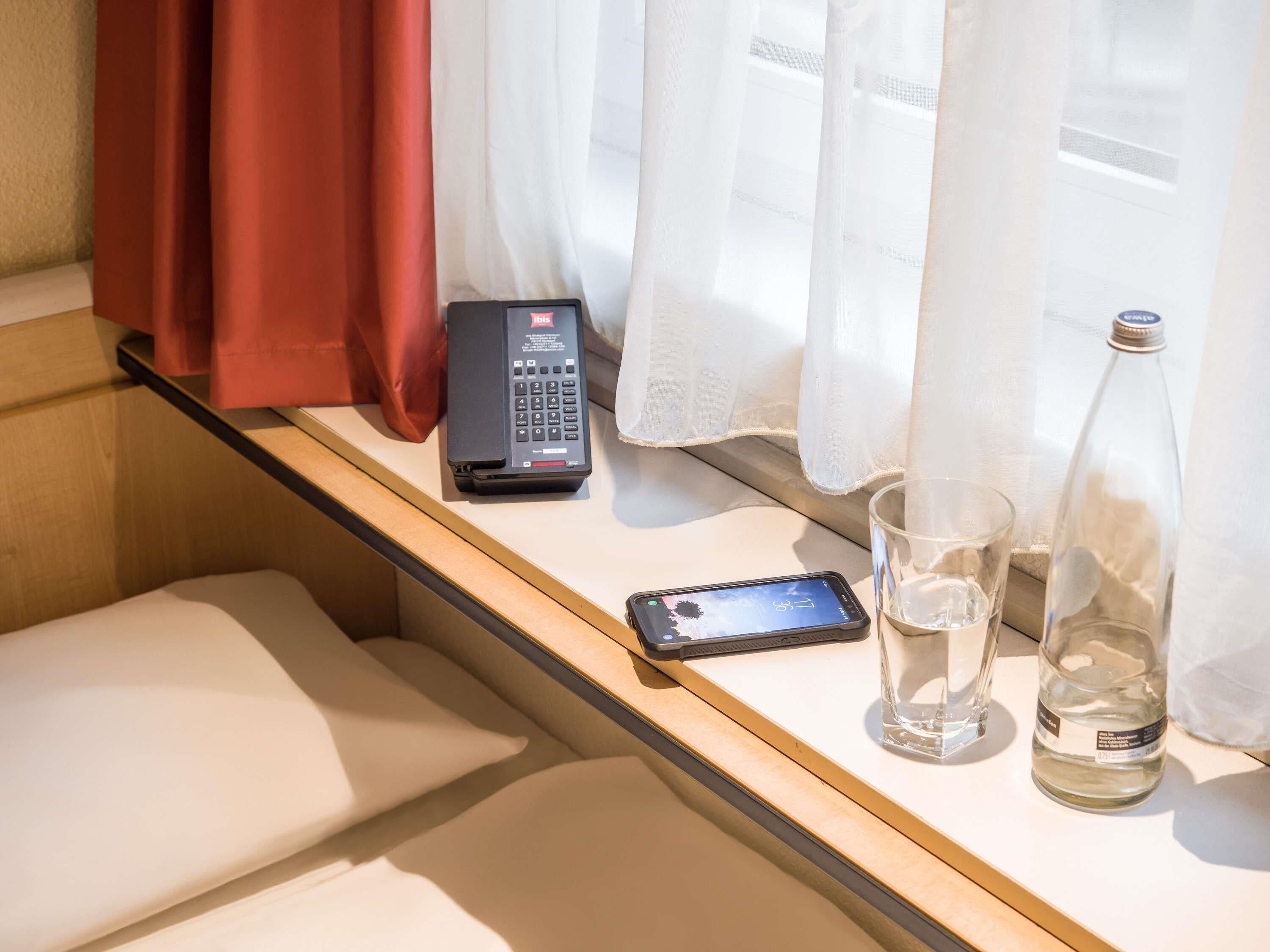 Hypo-allergenic bedding, desk, laptop workspace, blackout curtains