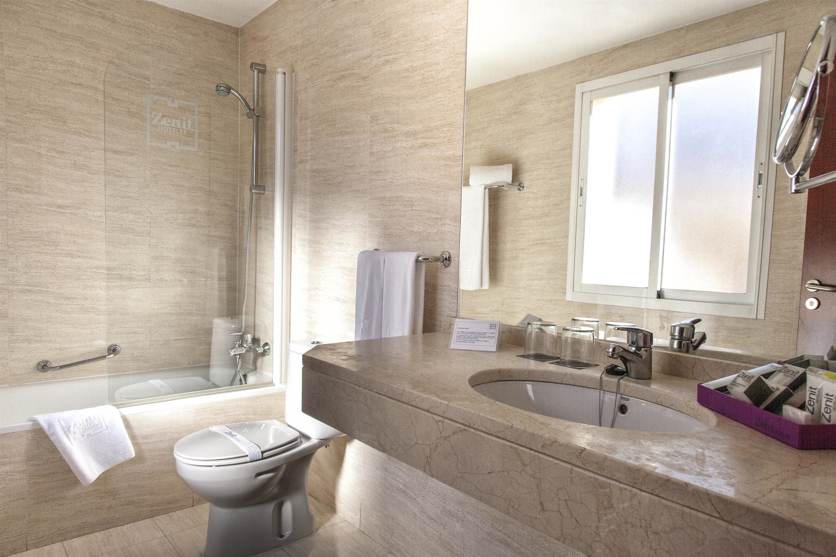 combined shower/bathtub, designer toiletries, hair dryer, bidet