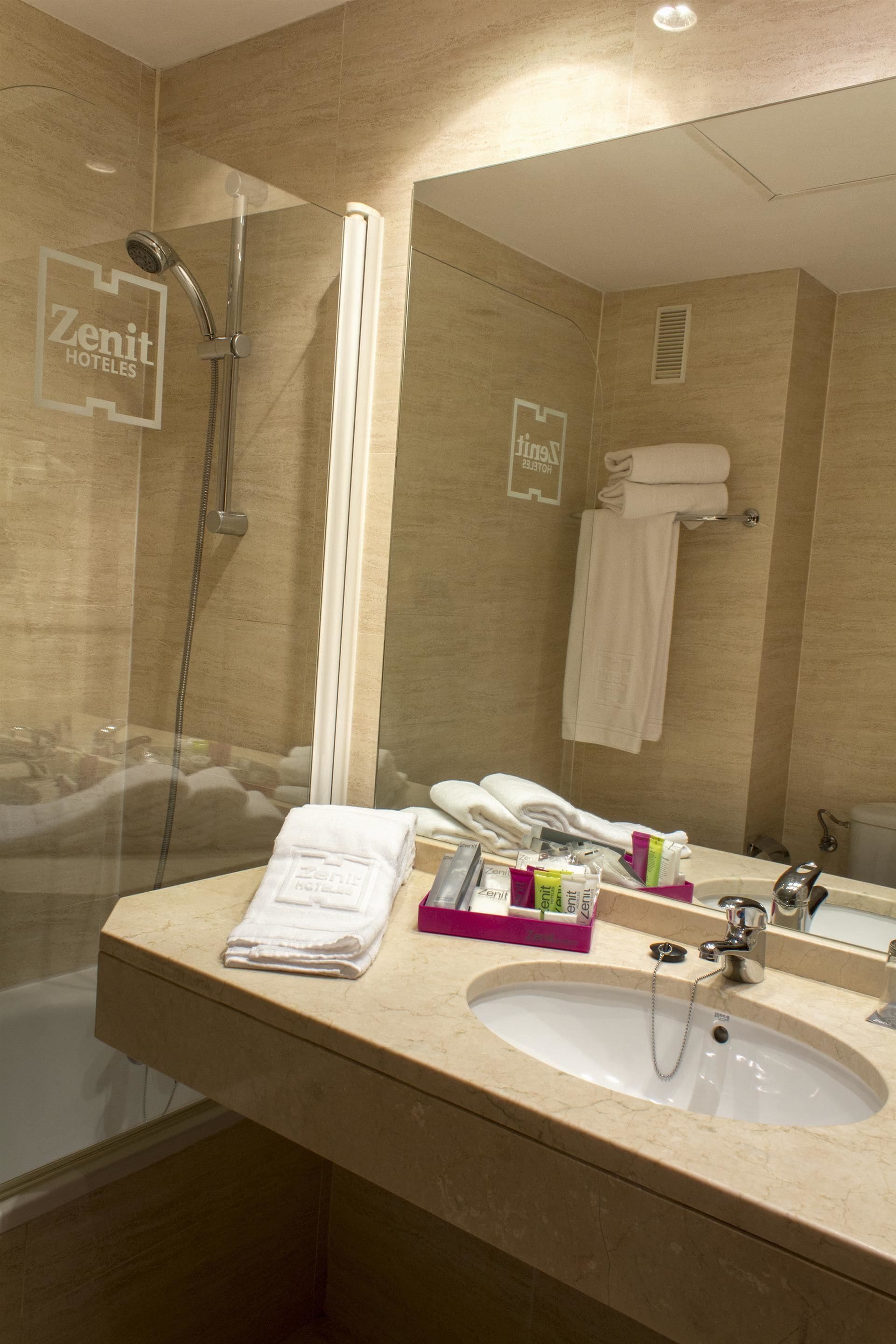 combined shower/bathtub, designer toiletries, hair dryer, bidet