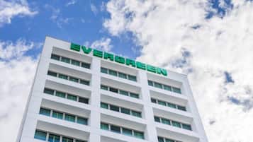 A multi-story building with the name 'EVERGREEN' prominently displayed on the facade.