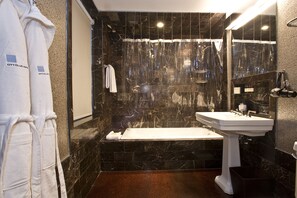 Shower, designer toiletries, hair dryer, bathrobes