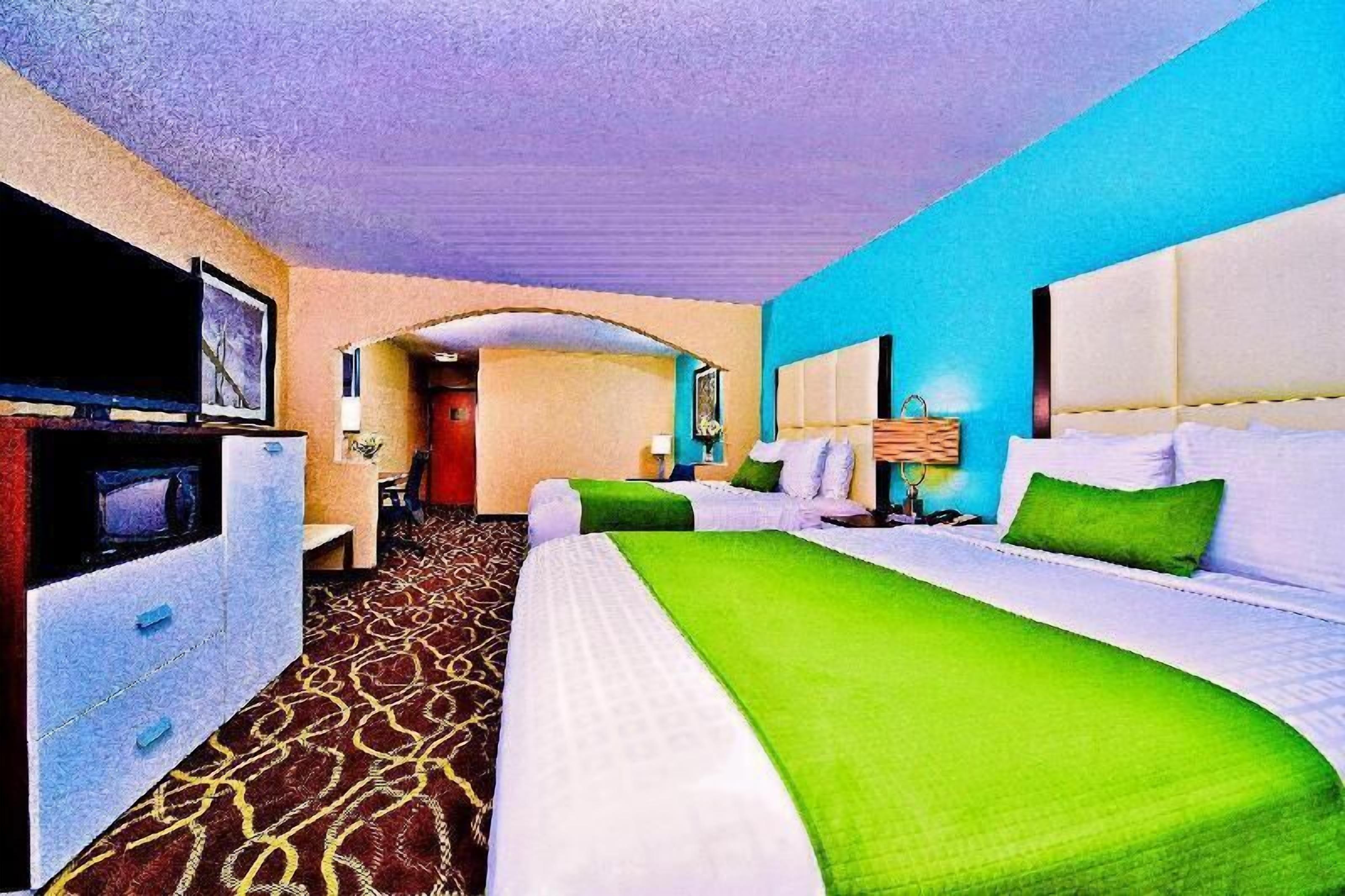 Premium bedding, desk, laptop workspace, blackout drapes
