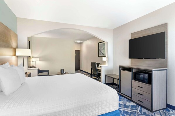 Premium bedding, desk, laptop workspace, blackout curtains