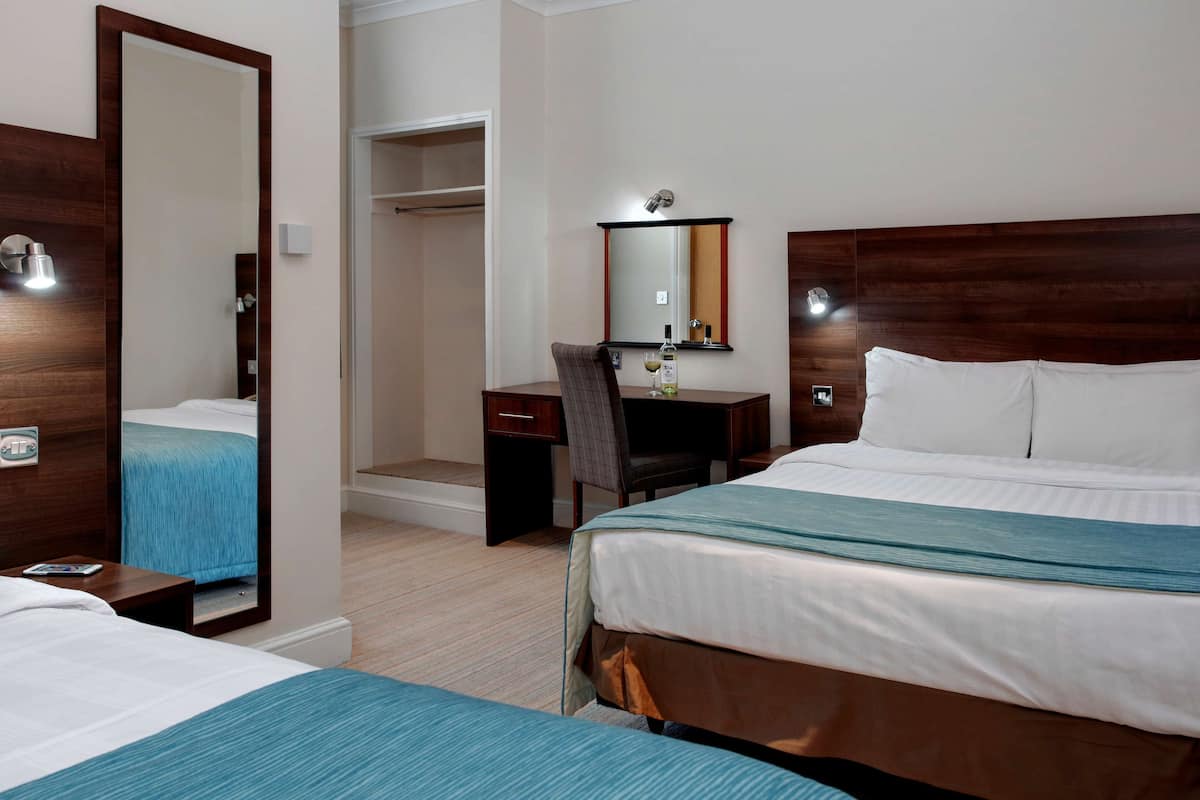 Standard Room, Multiple Beds, Non Smoking | Desk, laptop workspace, blackout curtains, iron/ironing board