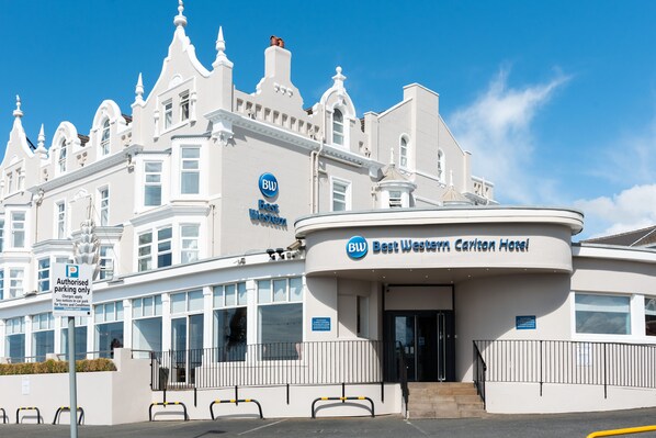 A large, white hotel with a classic architectural style, featuring a prominent Best Western sign. - Best Western Carlton Hotel (Blackpool)