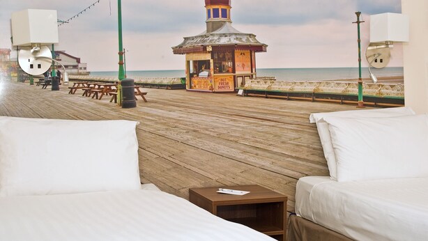 A beachside hotel room with a wooden deck, a gazebo, and a view of the beach. - Best Western Carlton Hotel (Blackpool)