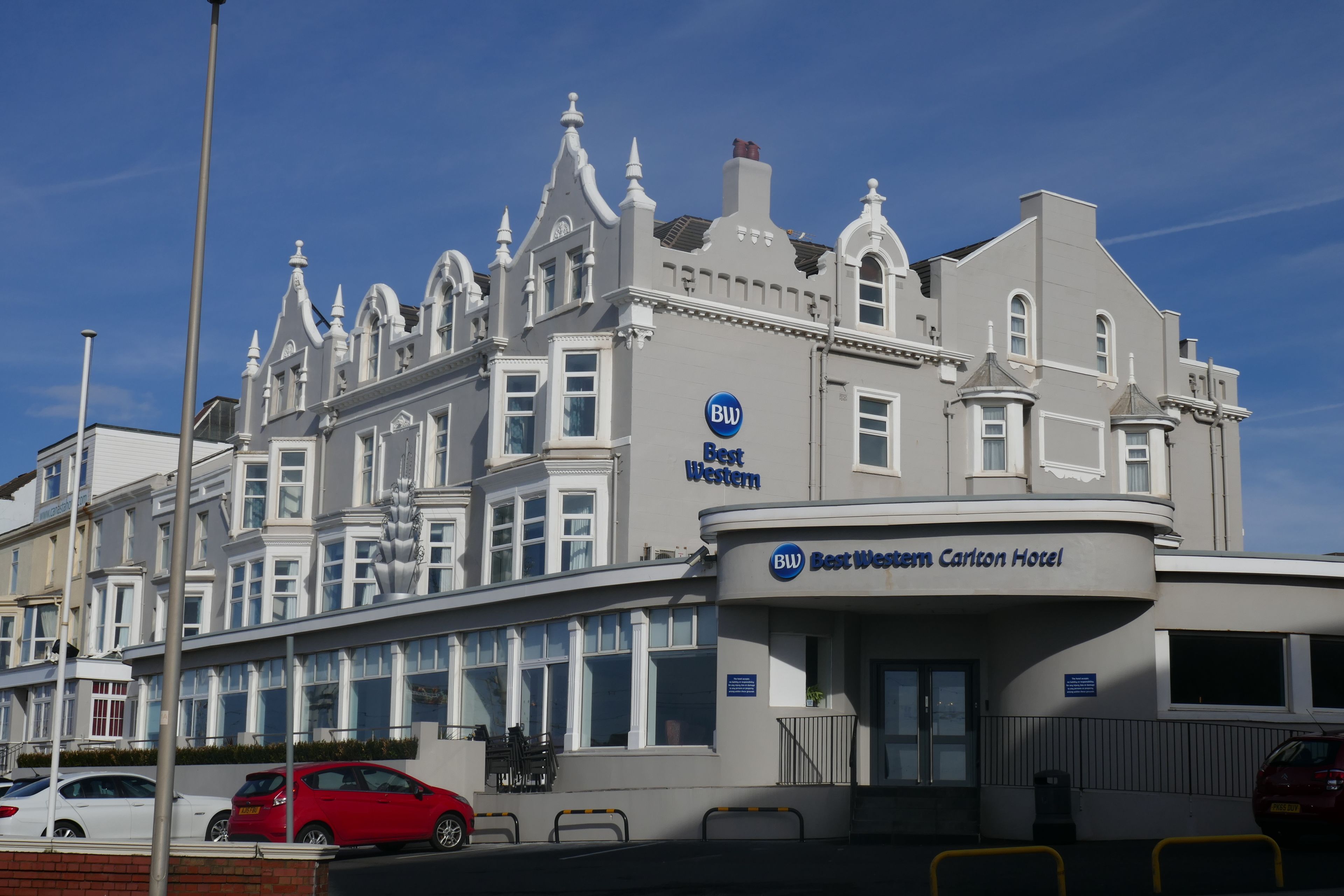 A large, historic building with a prominent 'Best Western' sign, multiple windows, and a classic architectural style.