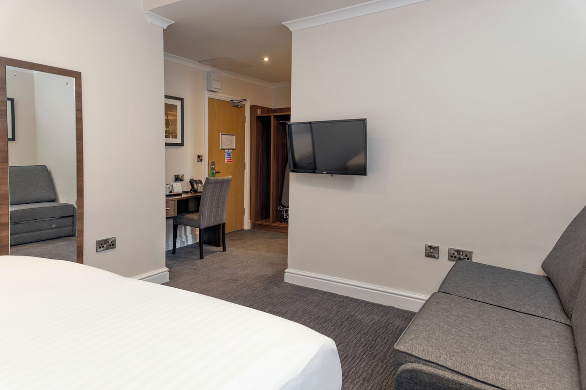 Family Room, 1 King Bed, Non Smoking (Converts to 2 Twin Beds;with Sofabed) | Desk, laptop workspace, blackout curtains, iron/ironing board