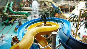 An indoor water park with multiple water slides and pools. - Best Western Carlton Hotel (Blackpool)