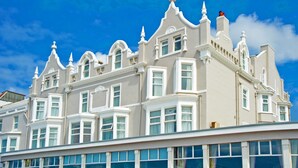 A large, white, multi-story building with numerous windows and decorative architectural features. - Best Western Carlton Hotel (Blackpool)
