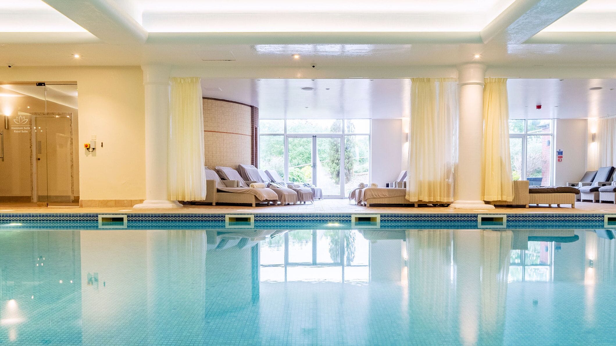 indoor pool, open 7:30 am to 8:00 pm, pool loungers