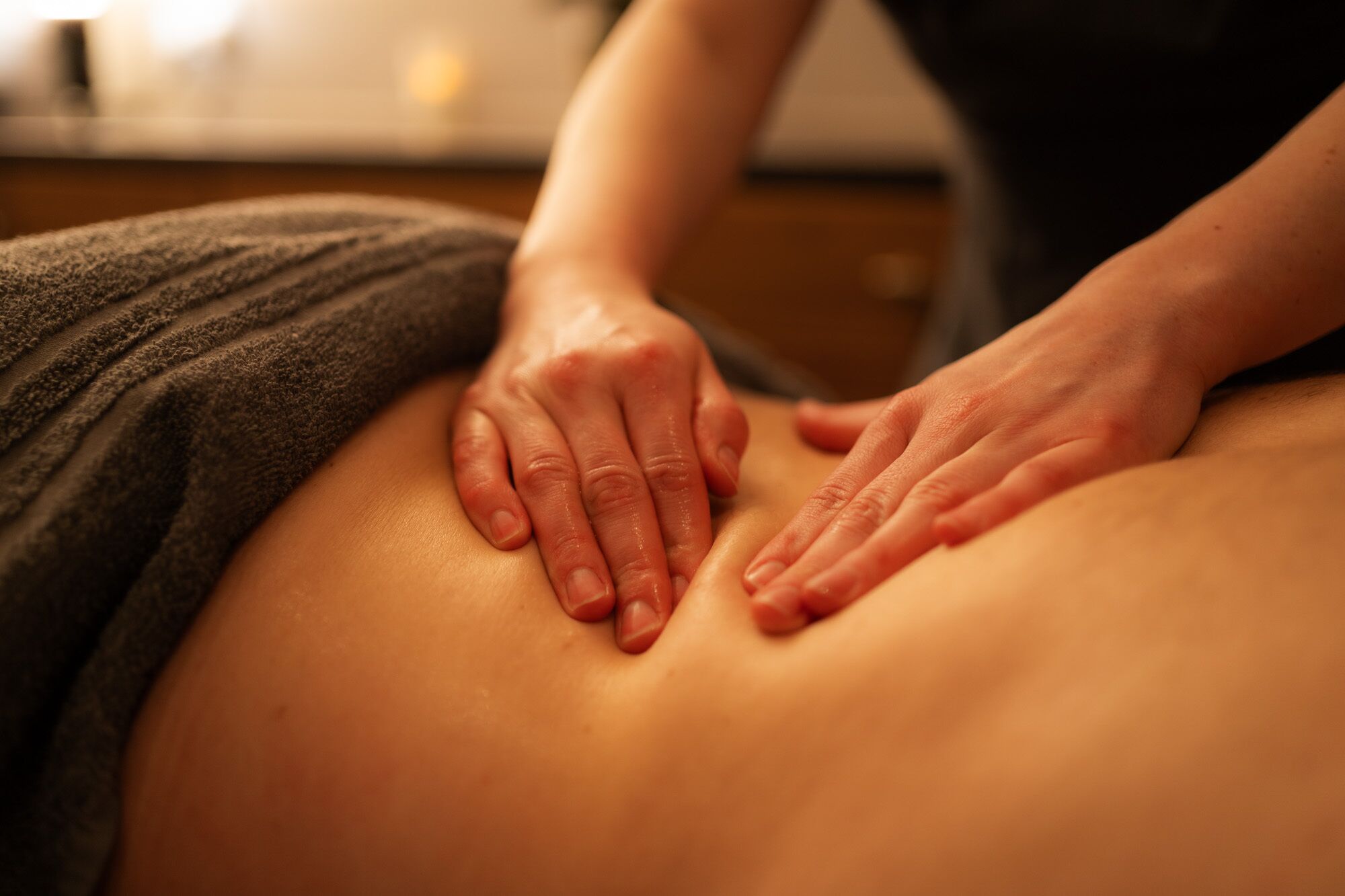A person receiving a back massage.