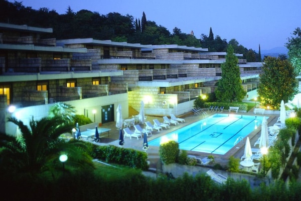 Seasonal outdoor pool, open 10:00 AM to 8:00 PM, pool umbrellas