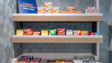 A snack display with various chips and snacks.