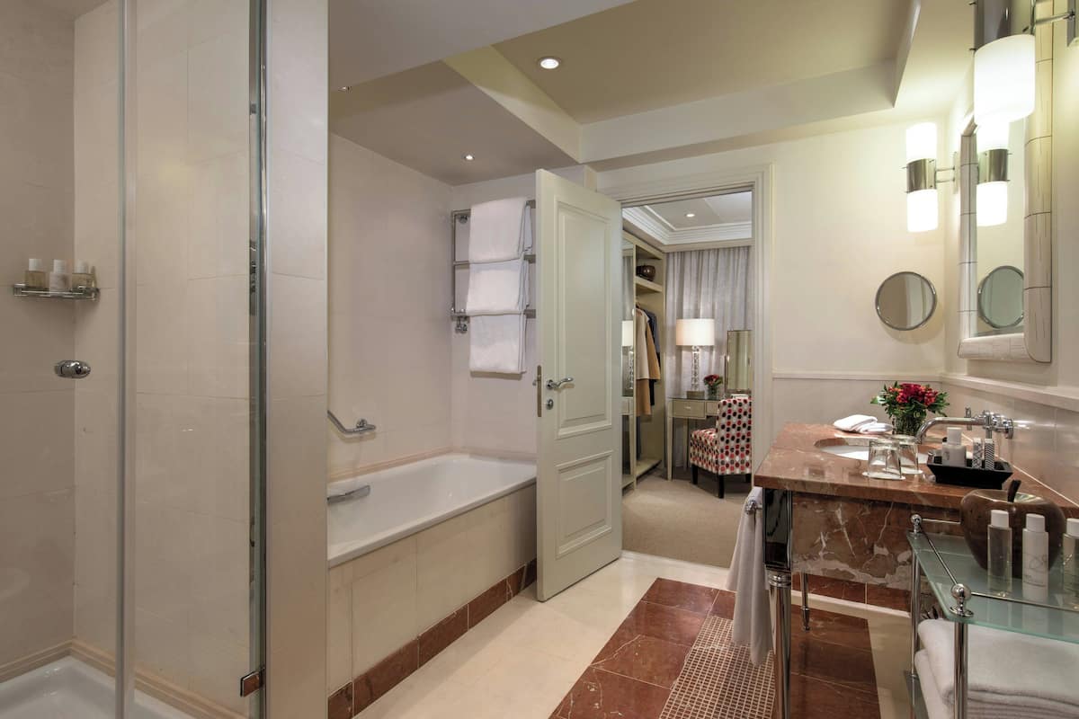 presidential suite | bathroom | separate bathtub and shower, rainfall showerhead, designer toiletries