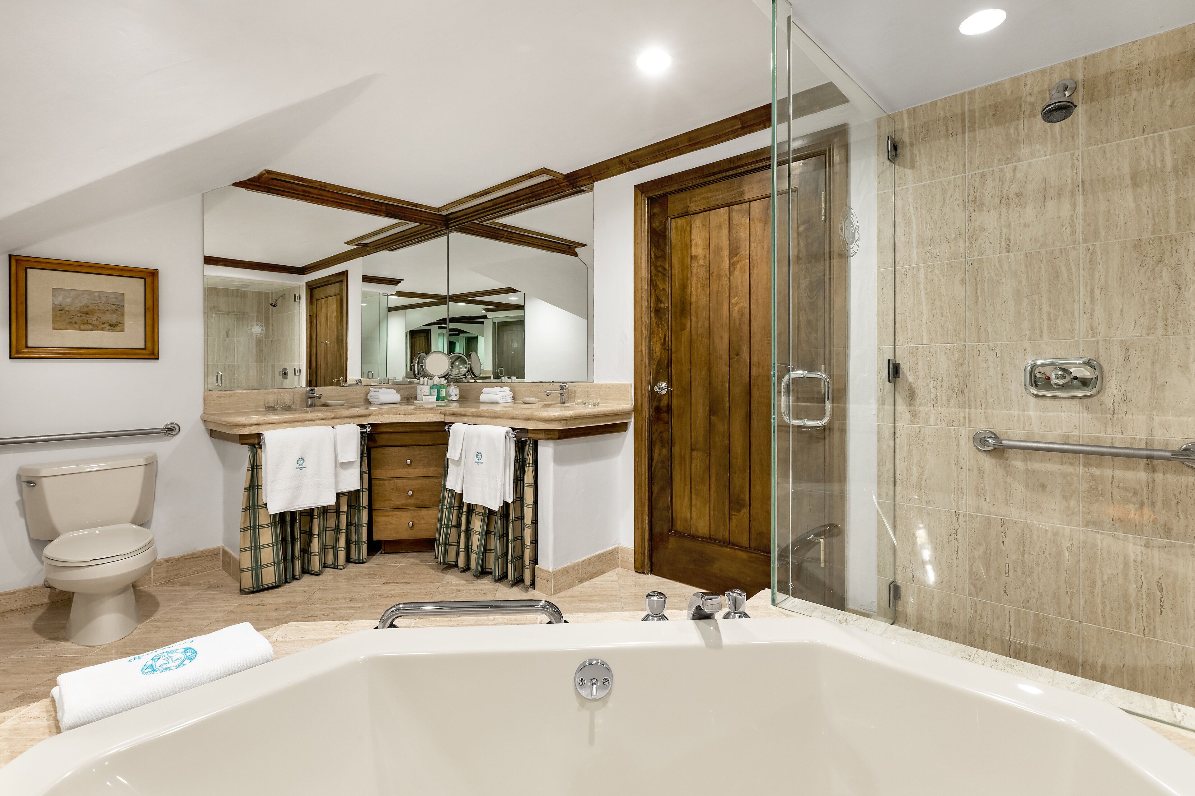 separate bathtub and shower, deep-soaking bathtub, designer toiletries