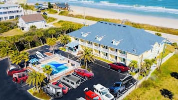 A 1-acre private beach with a building, parking, and a pool.