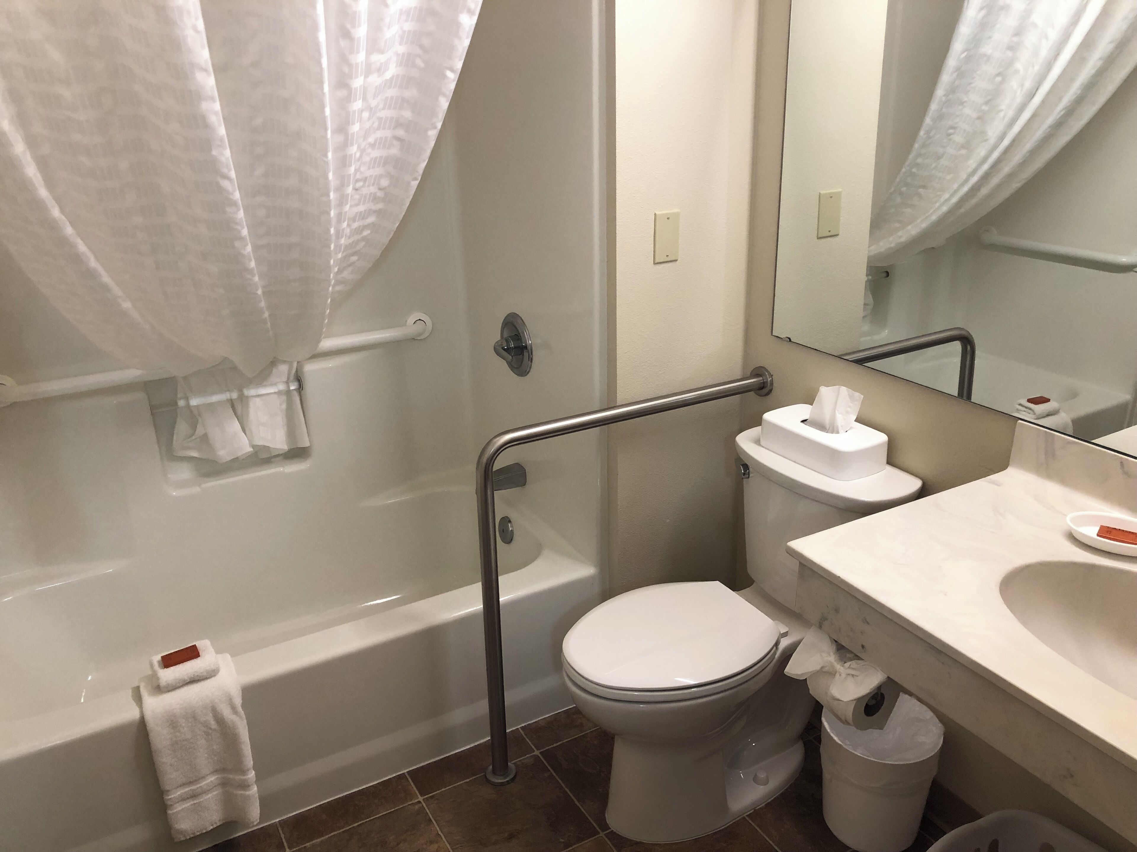 deluxe room, 1 king bed | bathroom | hair dryer, towels