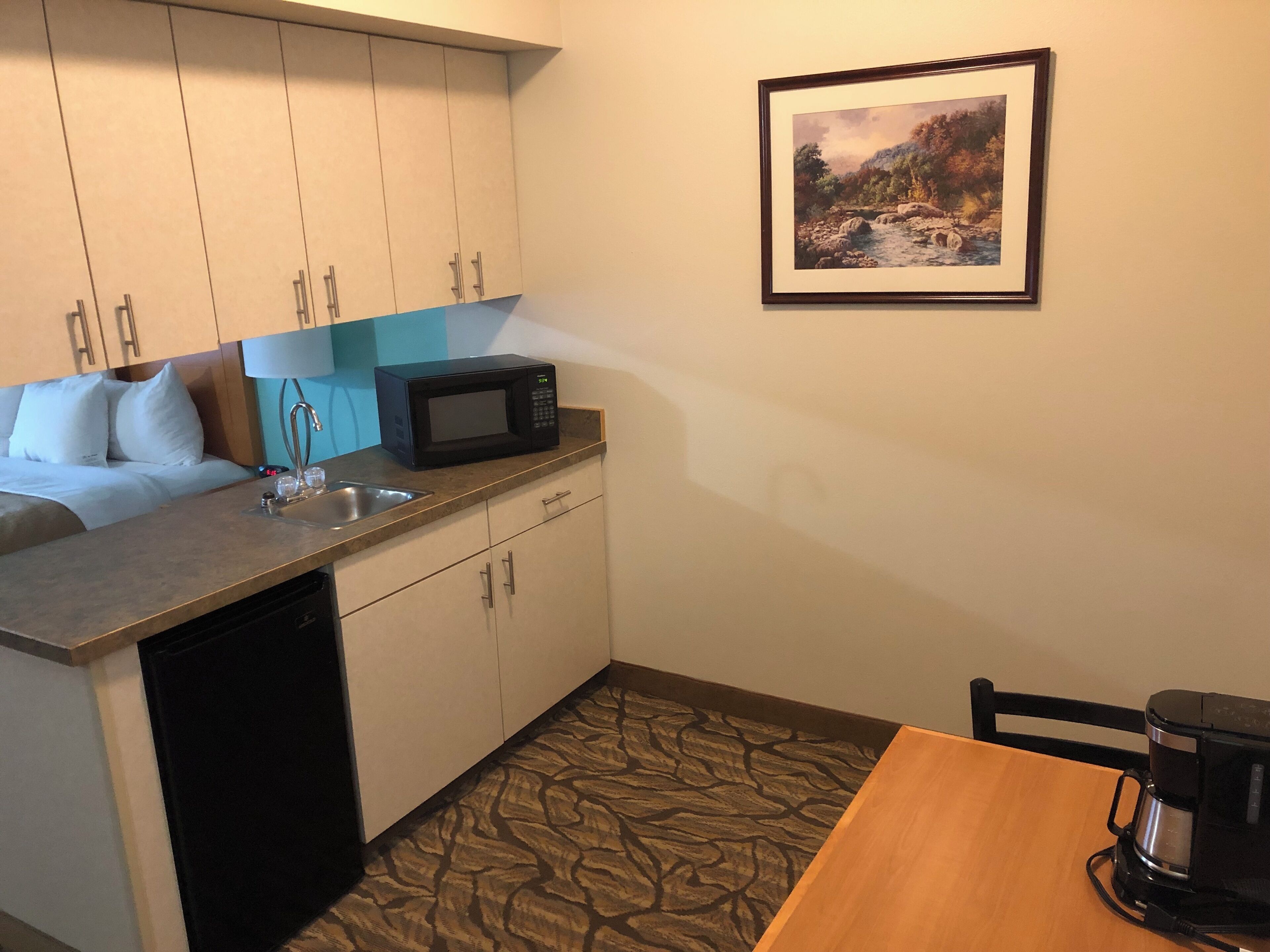 deluxe room, 1 king bed | premium bedding, desk, blackout curtains, iron/ironing board