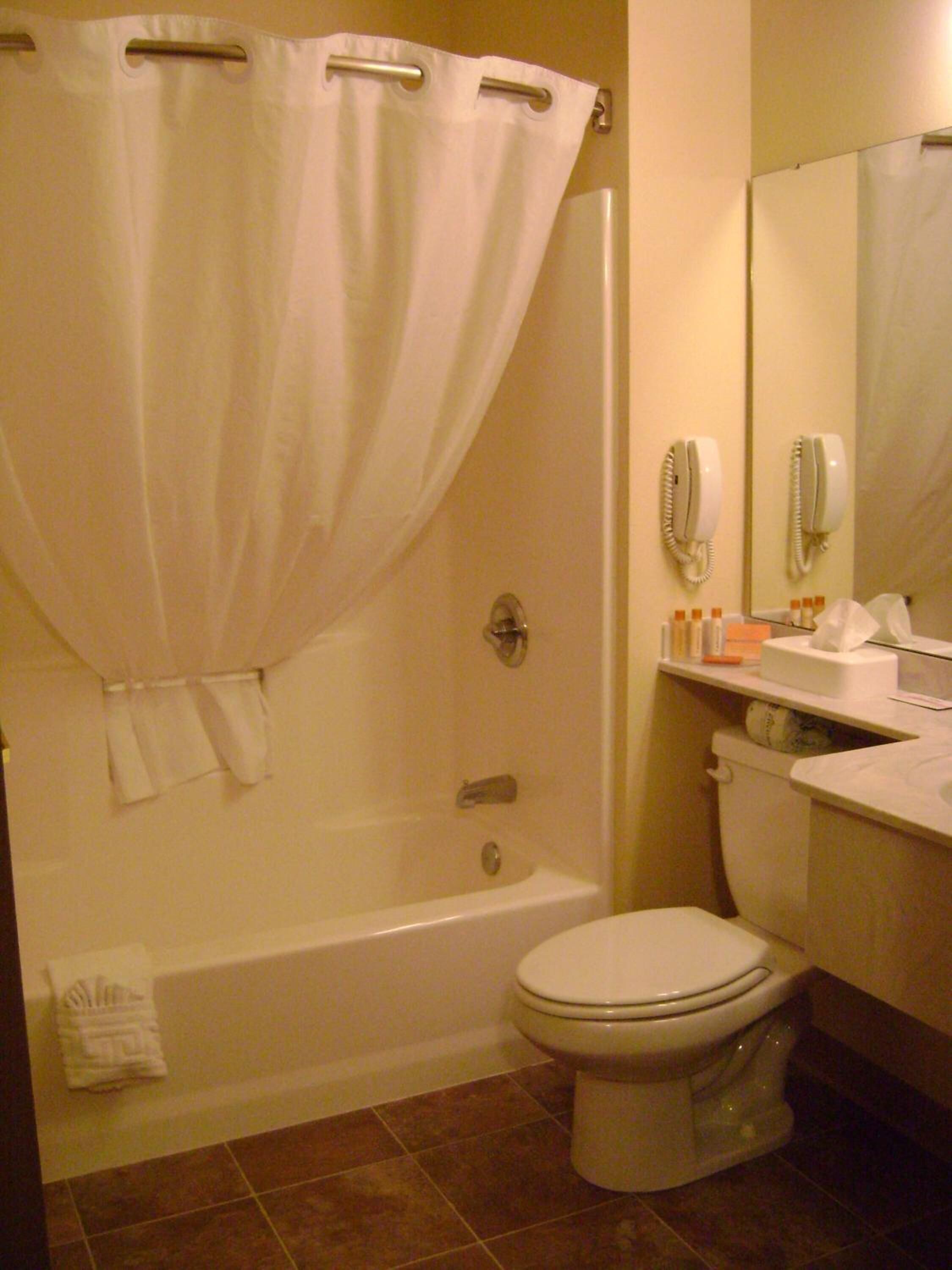 deluxe room, 1 king bed | bathroom | hair dryer, towels