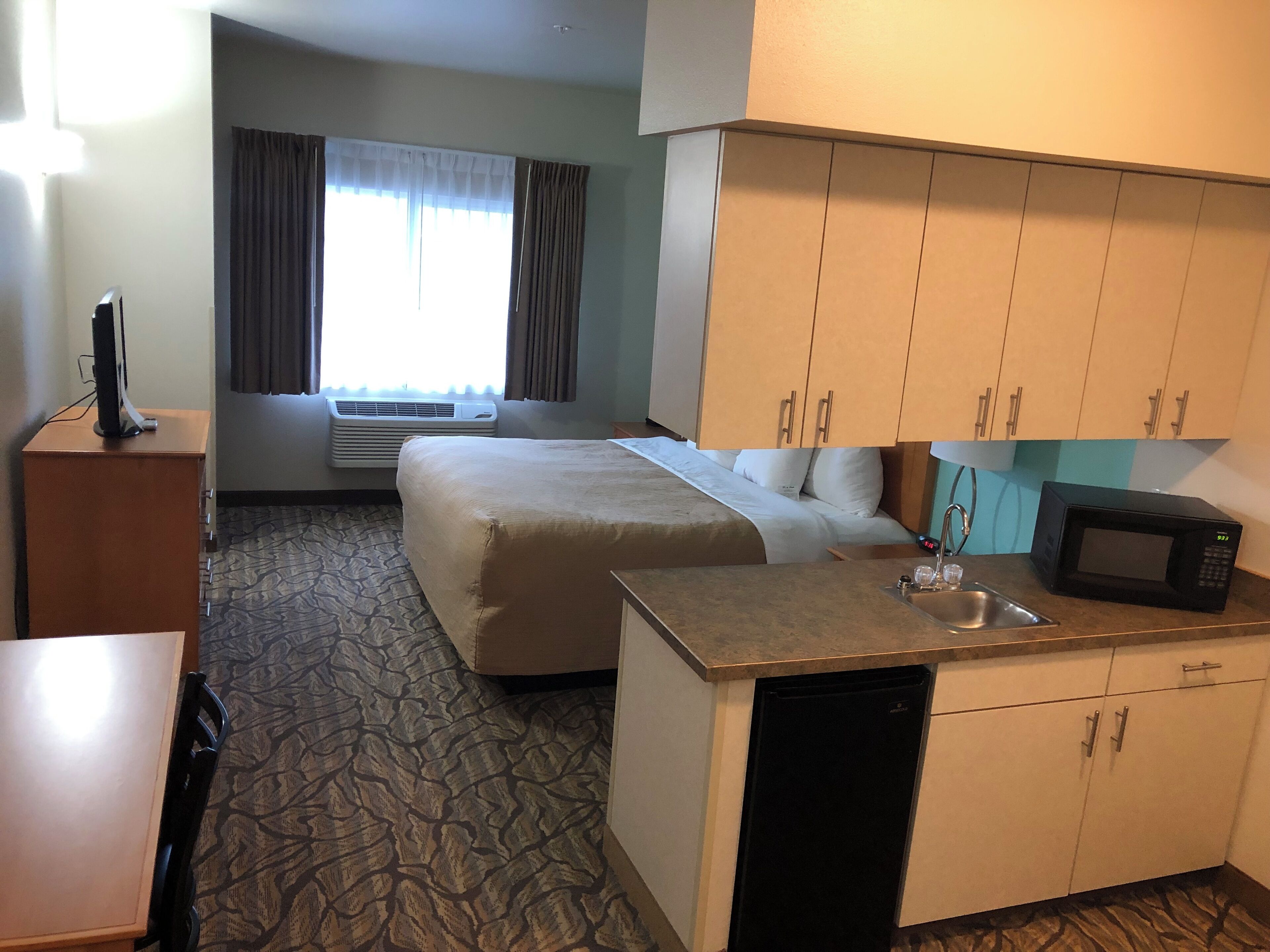 deluxe room, 1 king bed | premium bedding, desk, blackout curtains, iron/ironing board